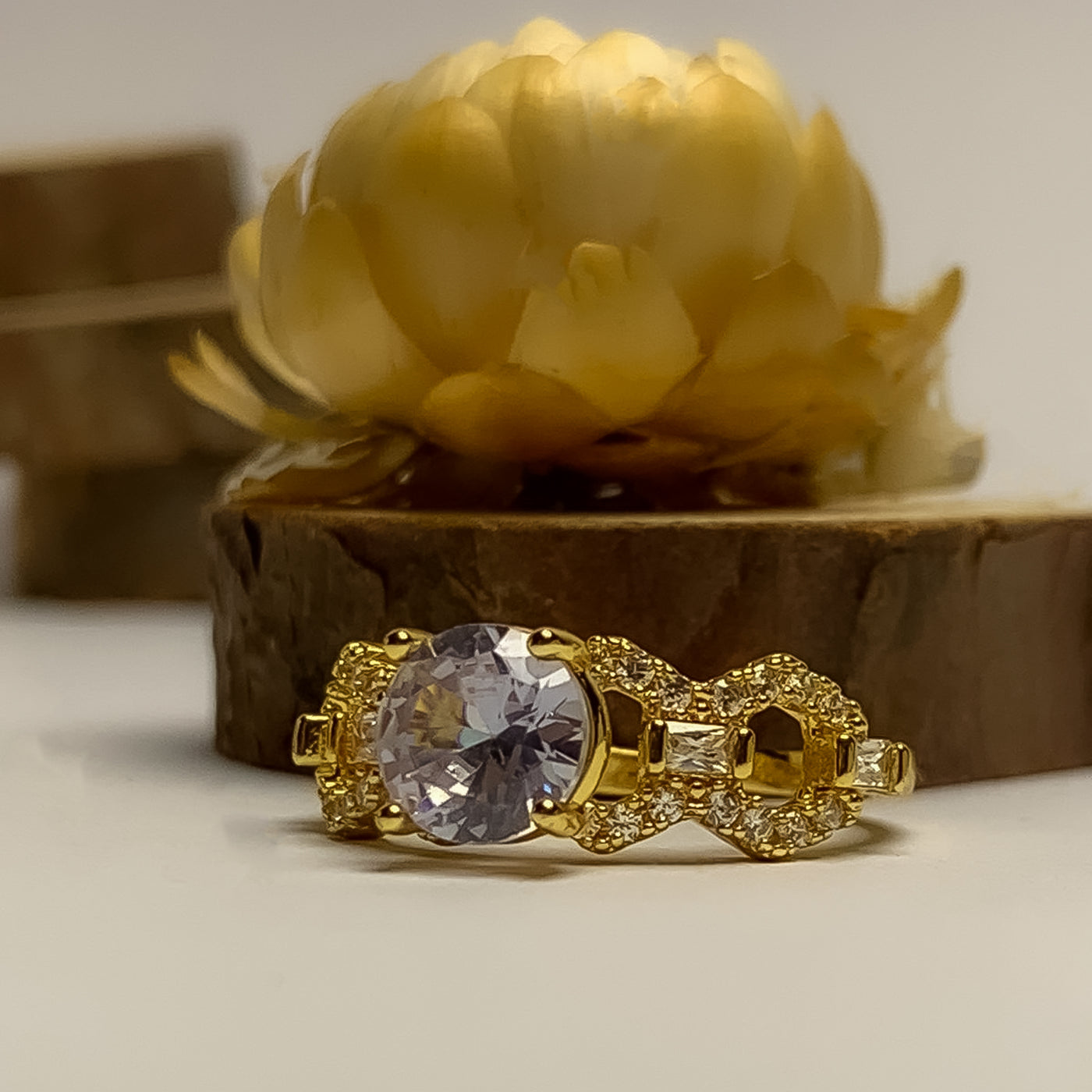 Golden Solitaire and Interlocking Pave Ring