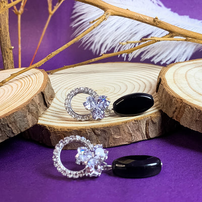 Modern Silver-Toned Floral and Black Teardrop Earrings