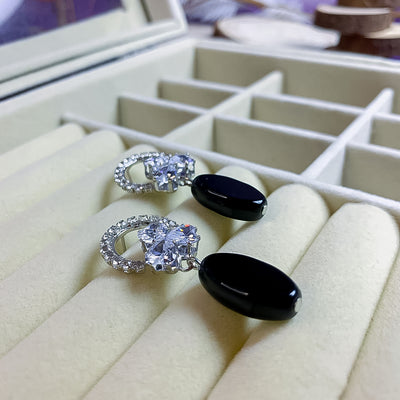 Modern Silver-Toned Floral and Black Teardrop Earrings