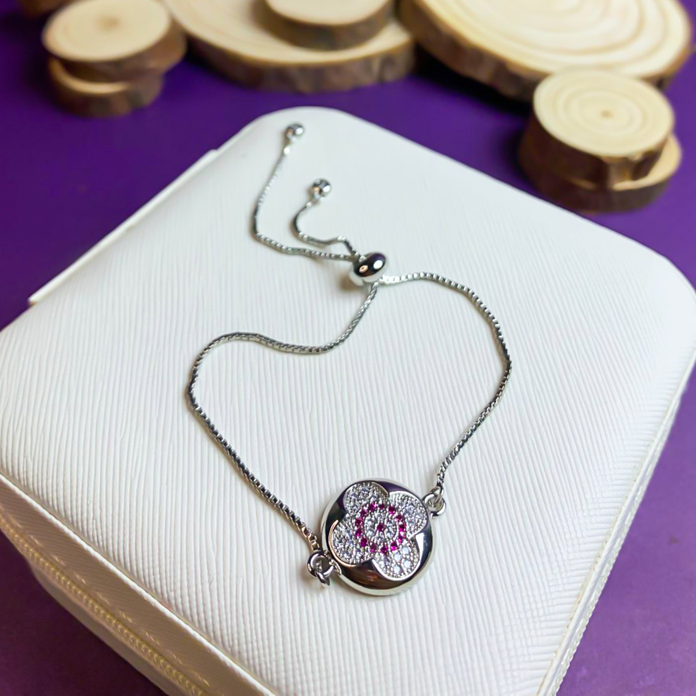 Elegant Silver-Toned Clover Slider Bracelet with Red Zircon